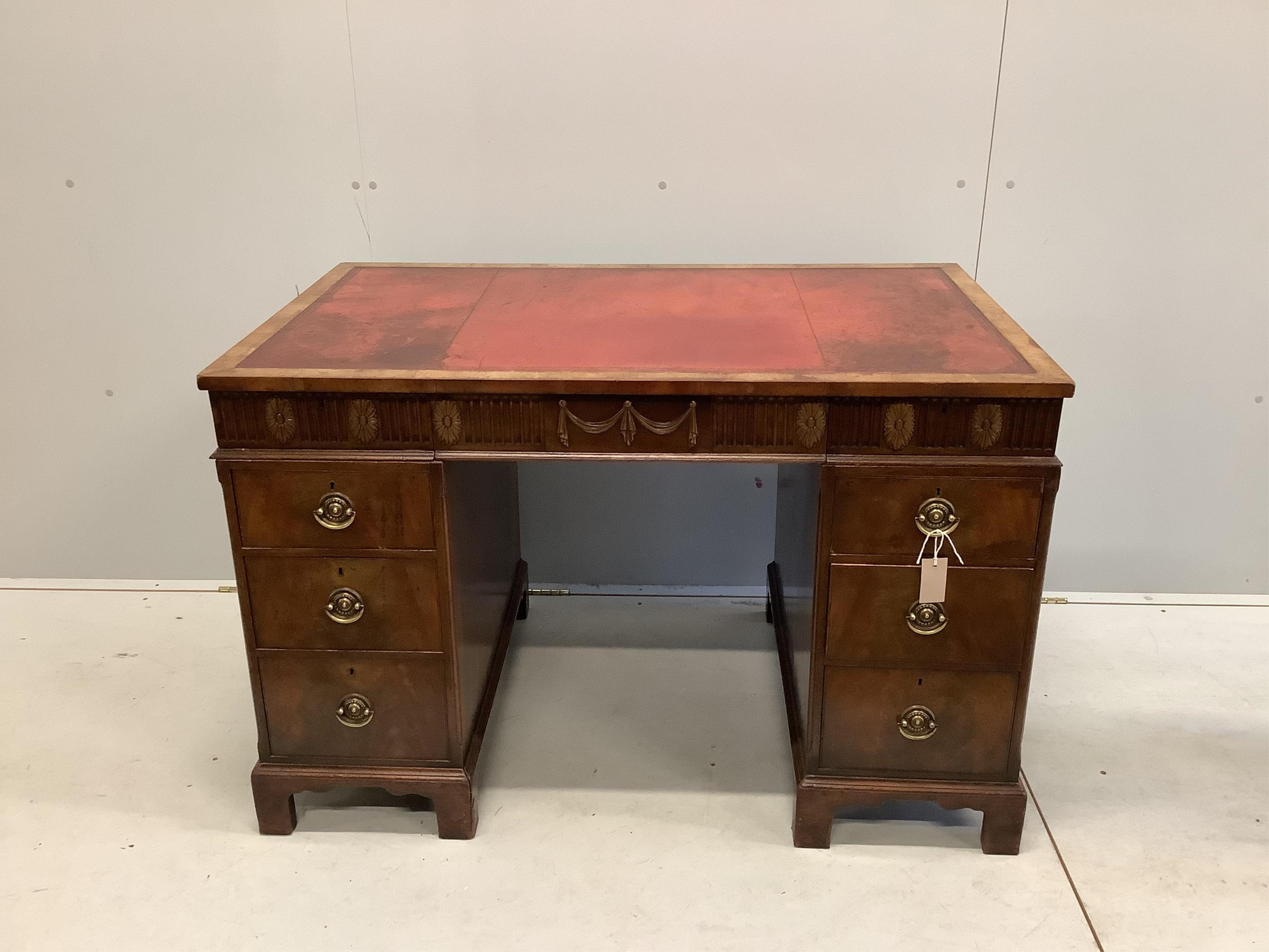 An early Georgian style walnut pedestal desk with inset leather top, width 117cm, depth 71cm, height 77cm. Condition - fair to good